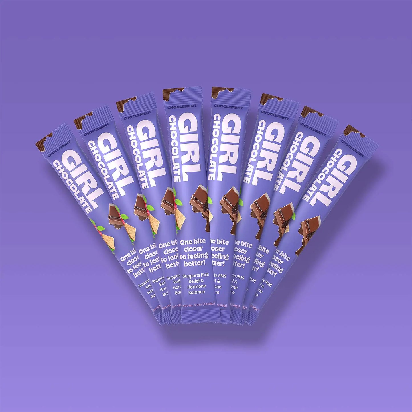 Multiple packages of Girl Chocolate on a purple background