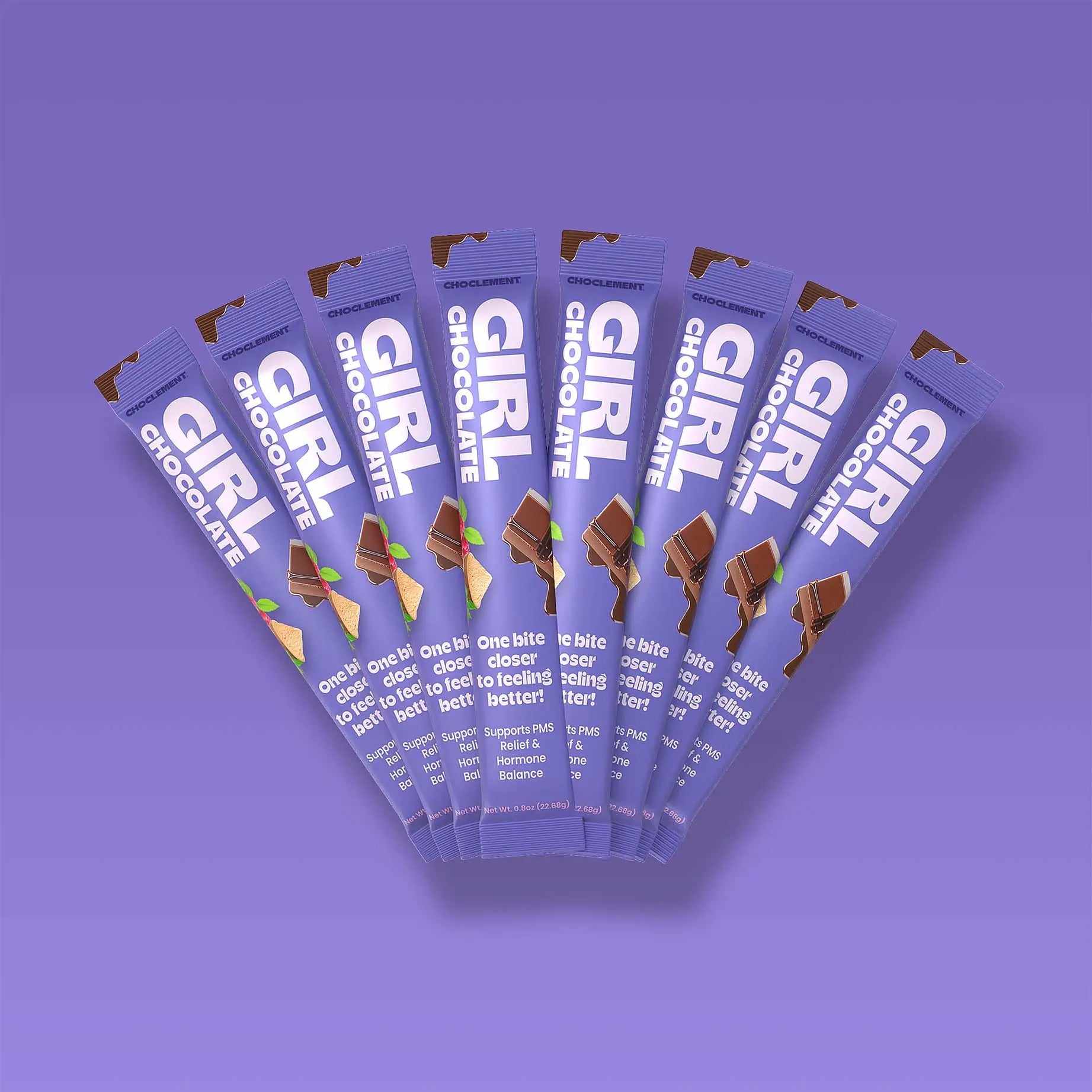 Multiple packages of Girl Chocolate on a purple background